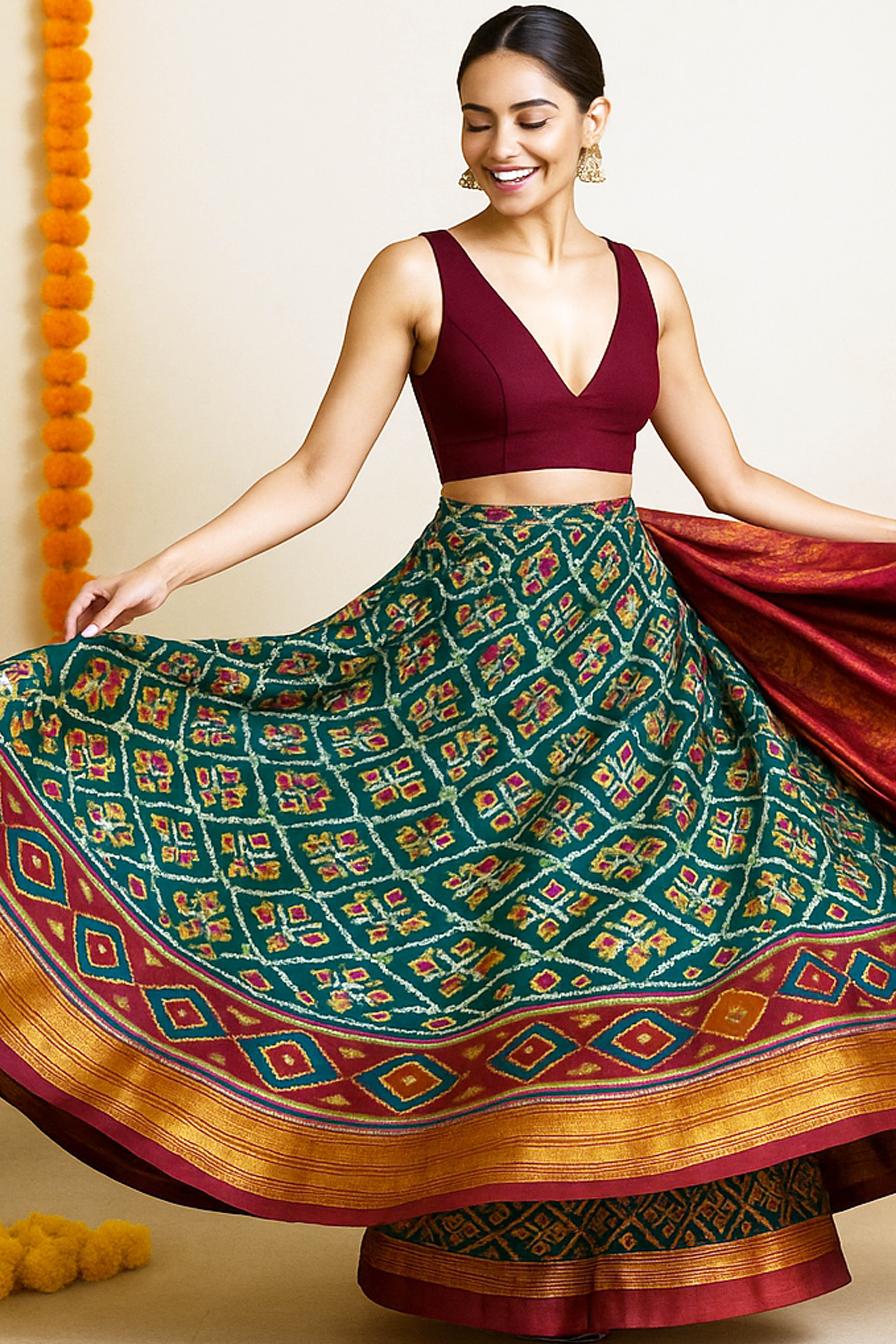 Aranya Elite & Rich Look Patola & Zig Zag Pattern Dual Tone Premium Dola Soft Silk Saree in Green & Maroon - Indian Handloomz