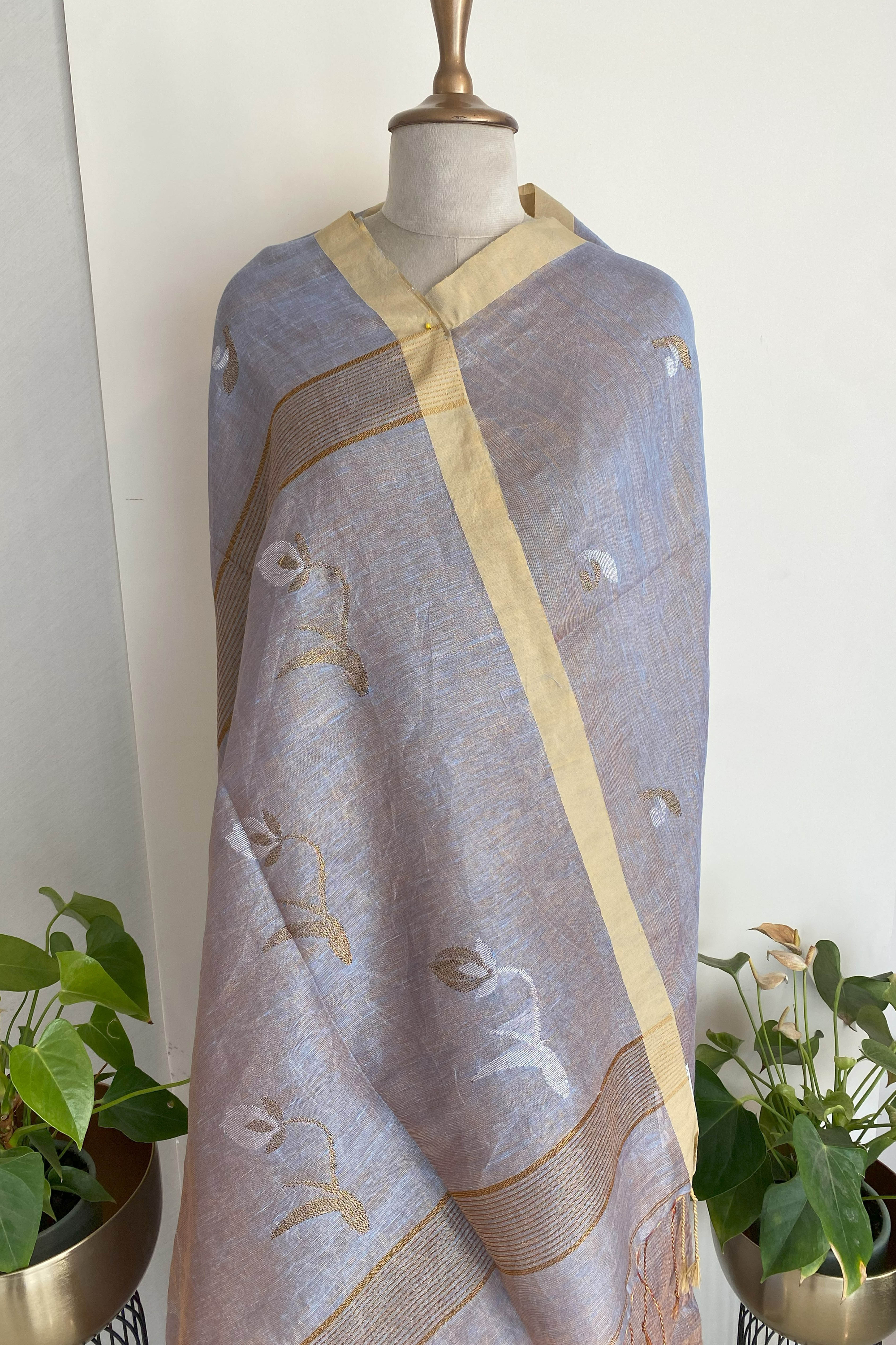 Urvashi Tissue Linen Saree in Grey Colour with Golden Zari