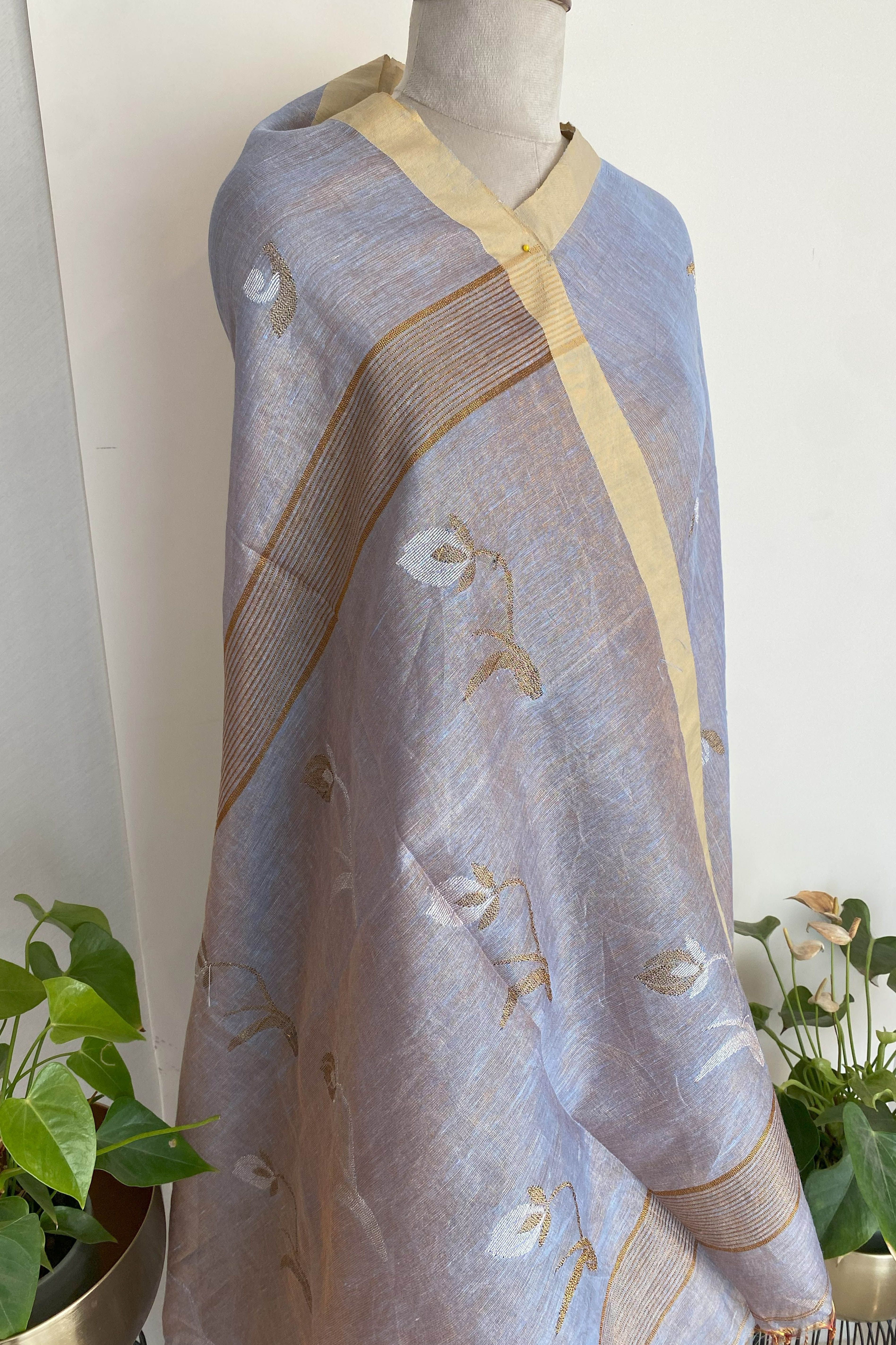 Urvashi Tissue Linen Saree in Grey Colour with Golden Zari