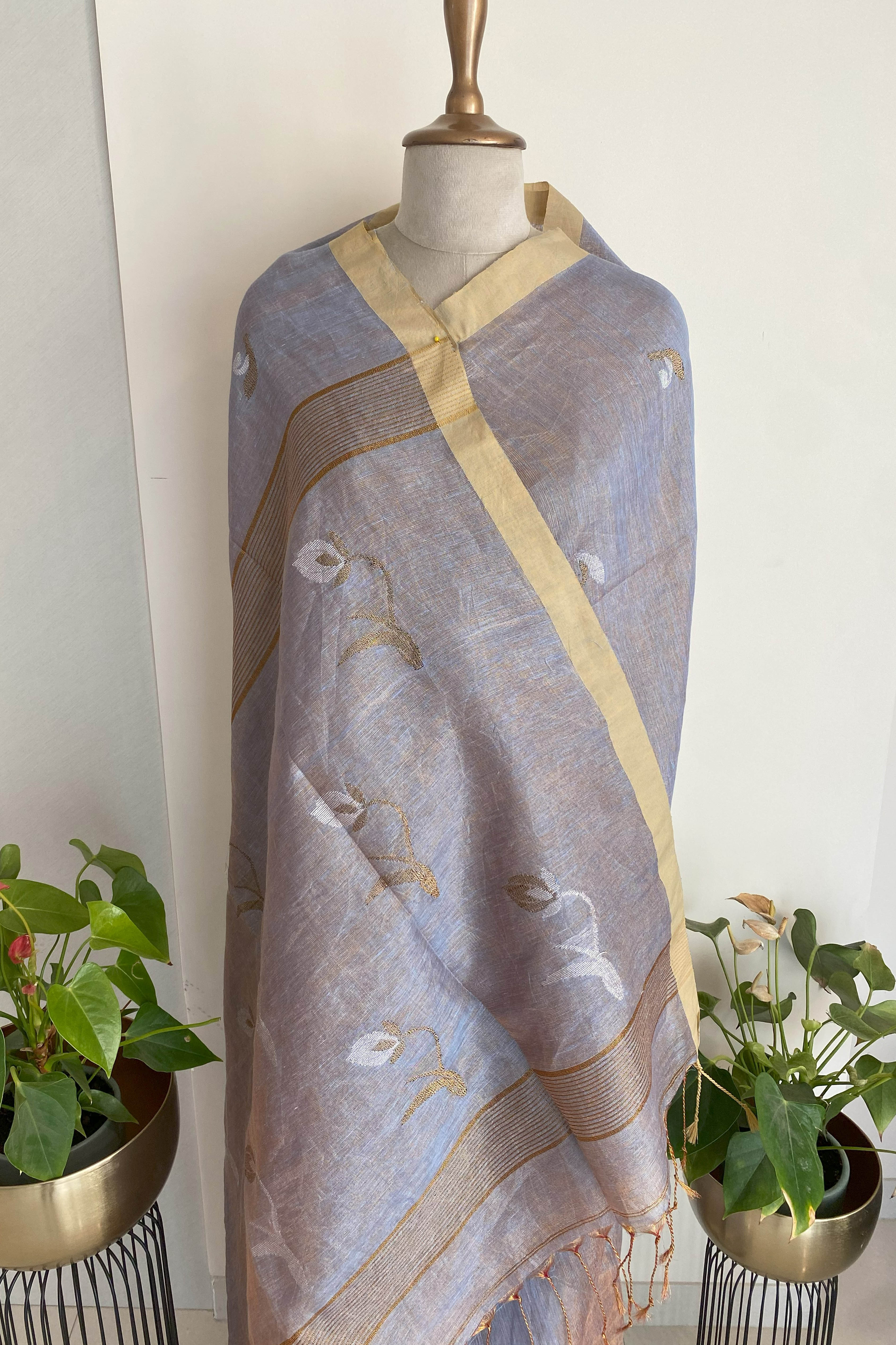 Urvashi Tissue Linen Saree in Grey Colour with Golden Zari