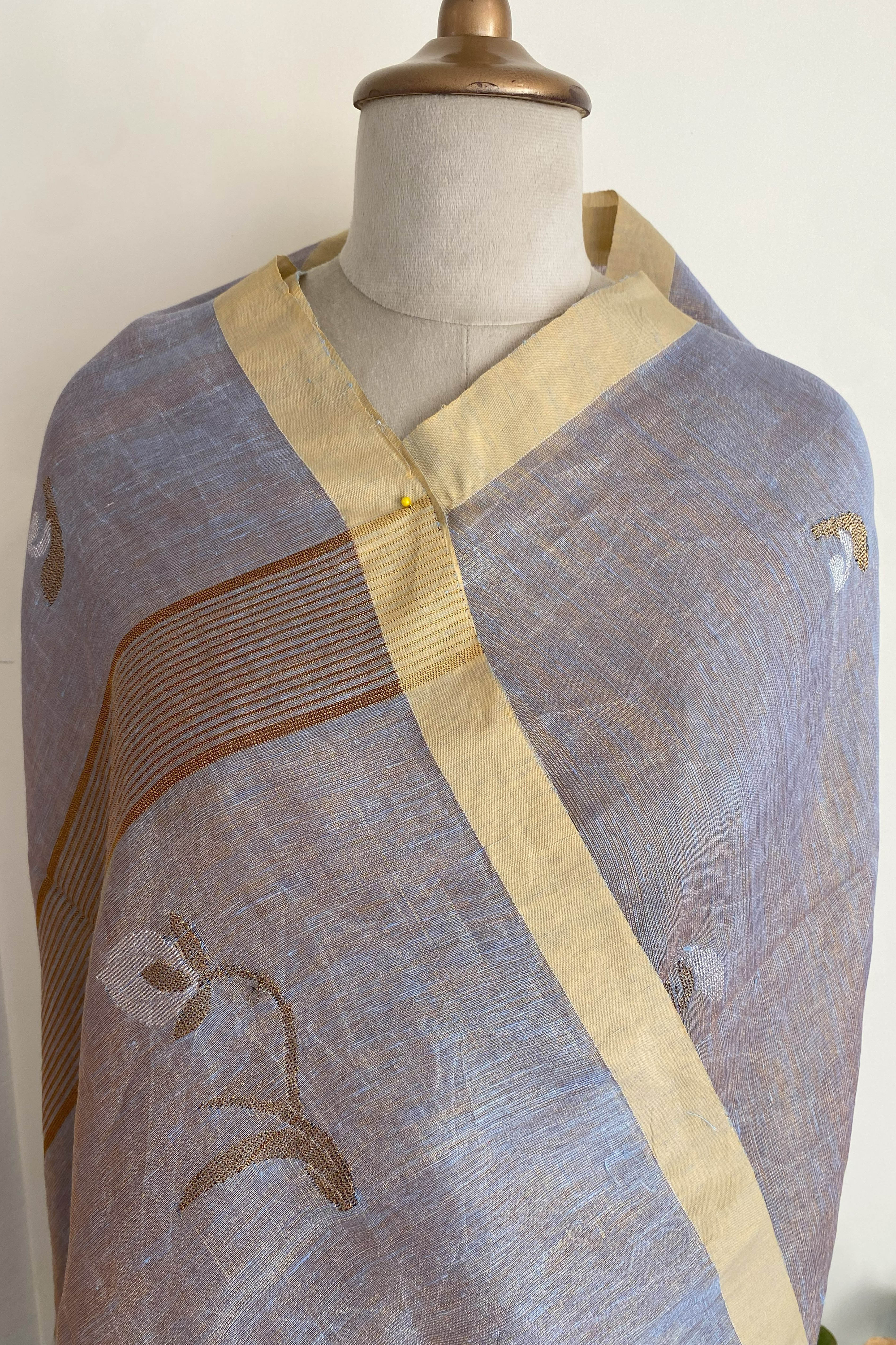 Urvashi Tissue Linen Saree in Grey Colour with Golden Zari