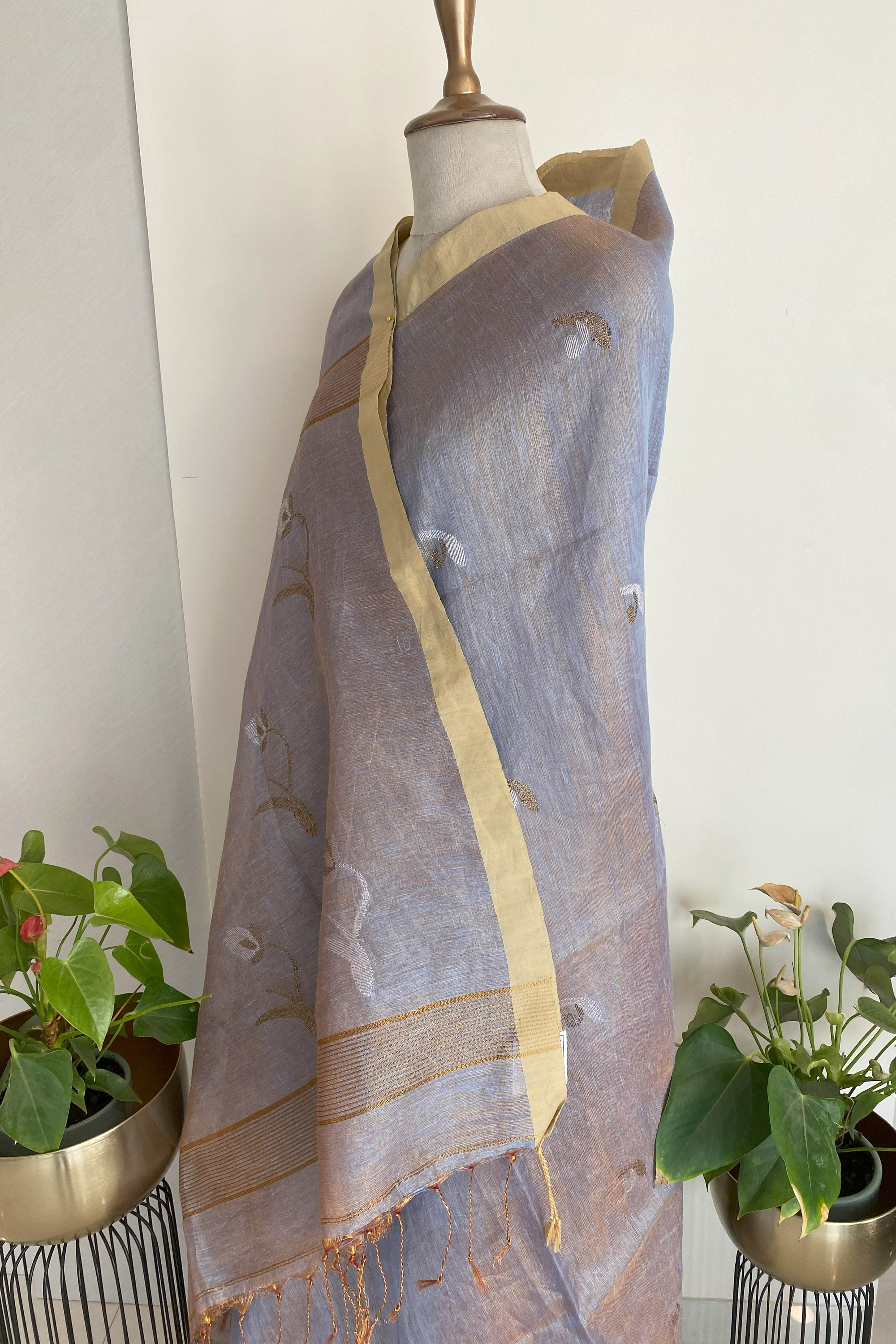 Urvashi Tissue Linen Saree in Grey Colour with Golden Zari