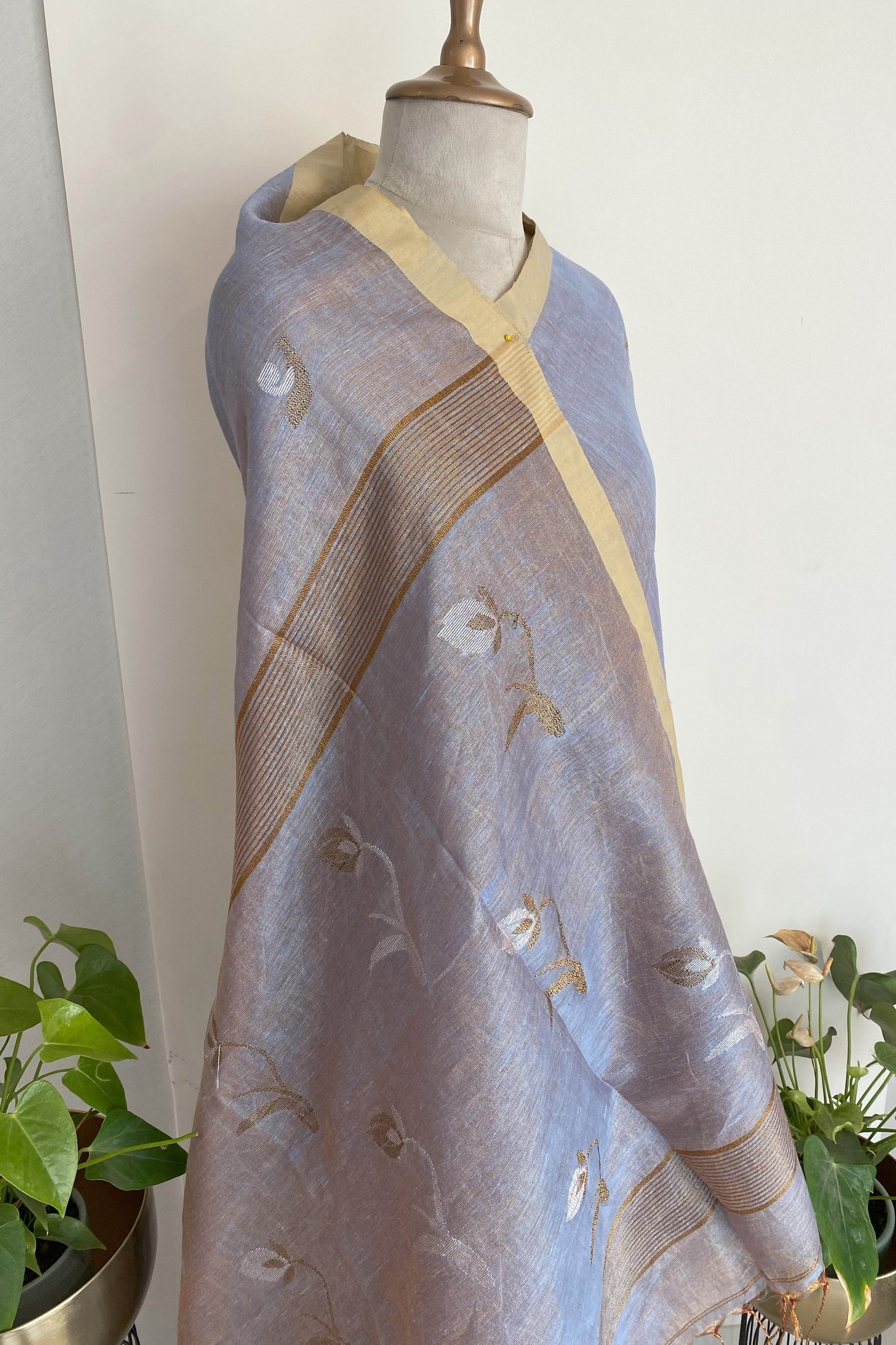 Urvashi Tissue Linen Saree in Grey Colour with Golden Zari